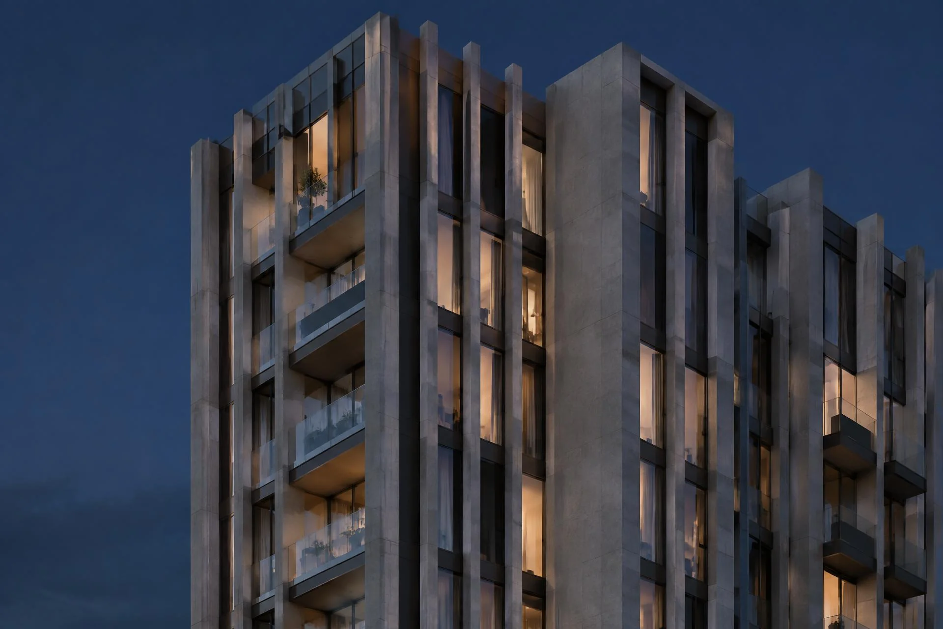 Fachada de edifício contemporâneo em concreto e vidro ao anoitecer